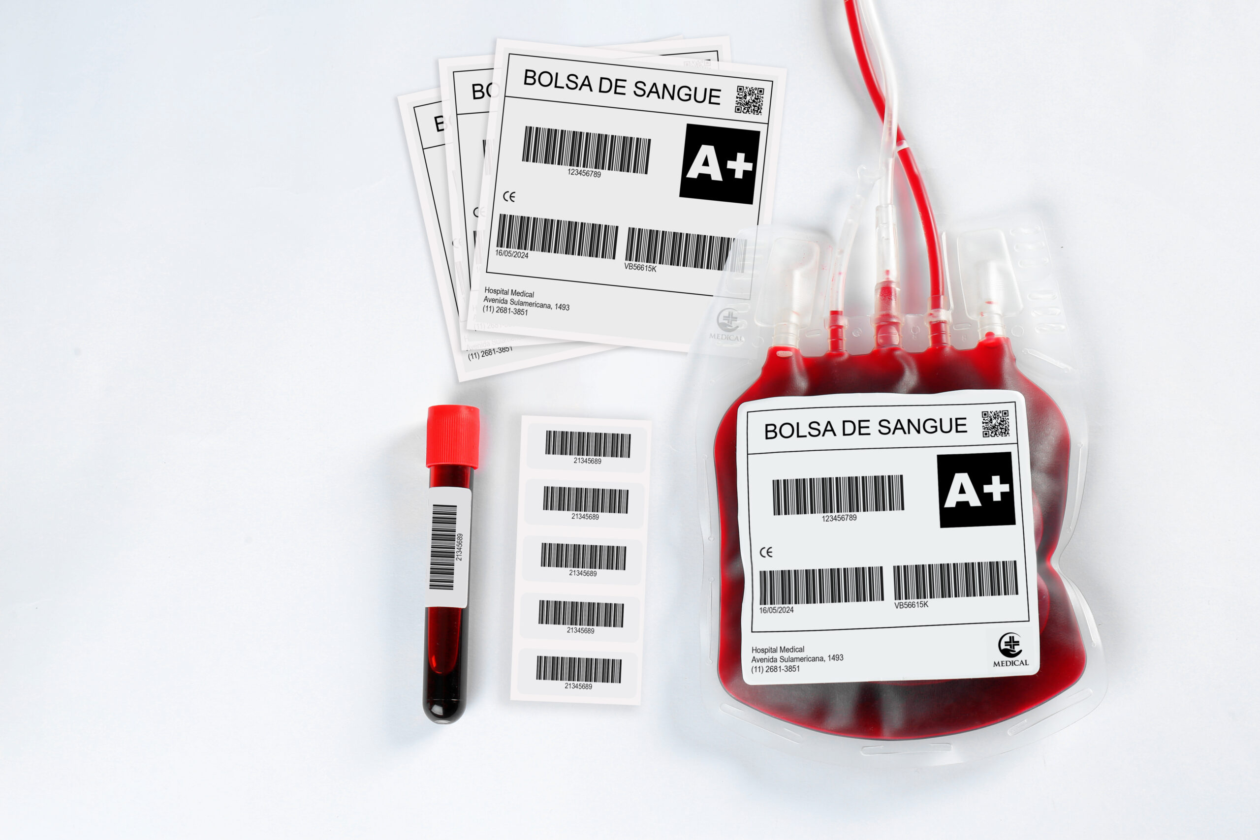 Blood pack for transfusion and test tube on white background, top view. Donation day