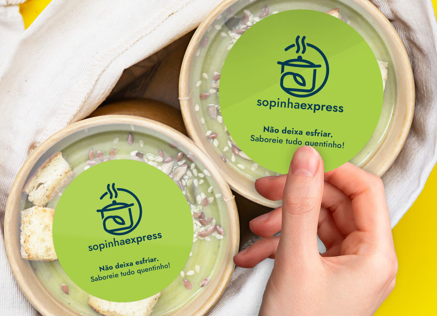 Vegetarian green cream soup in craft container for take away food. Ecological individual package. Delivery concept. Top view.